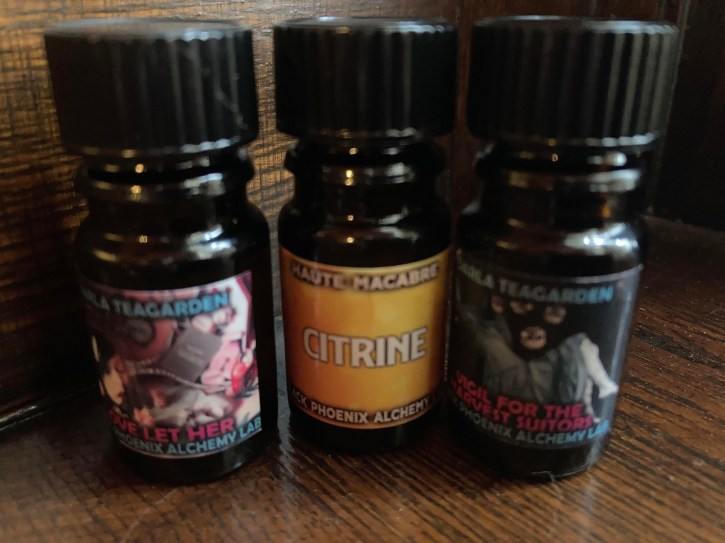 three perfume bottles from Black Phoenix Alchemy Lab in a row